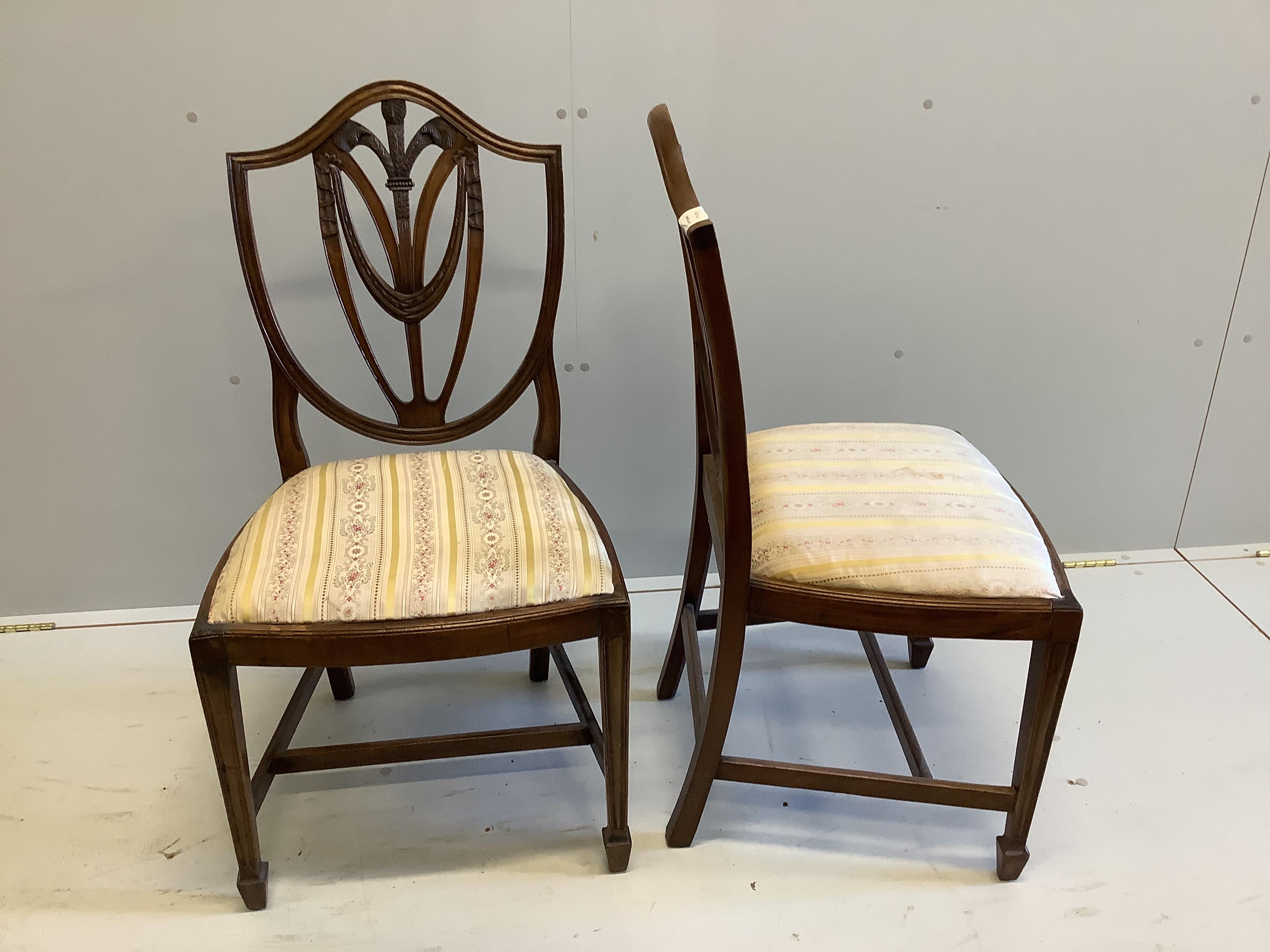 A set of four George III style mahogany dining chairs with Prince of Wales splat